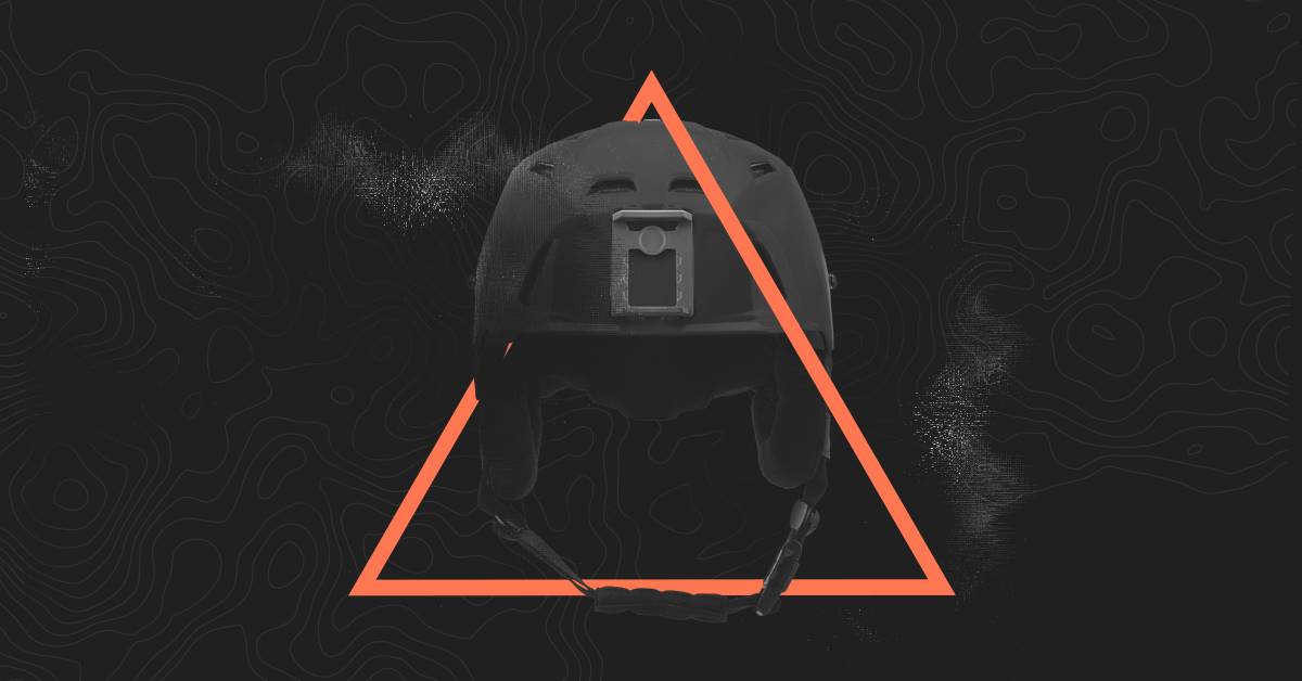 Image of black helmet with orange triangle graphic 