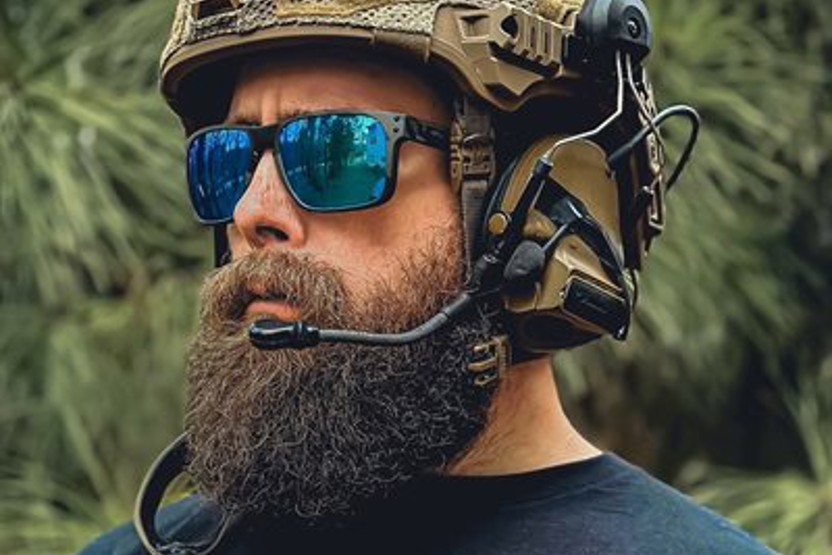 Image of bearded man wearing sunglasses and helmet