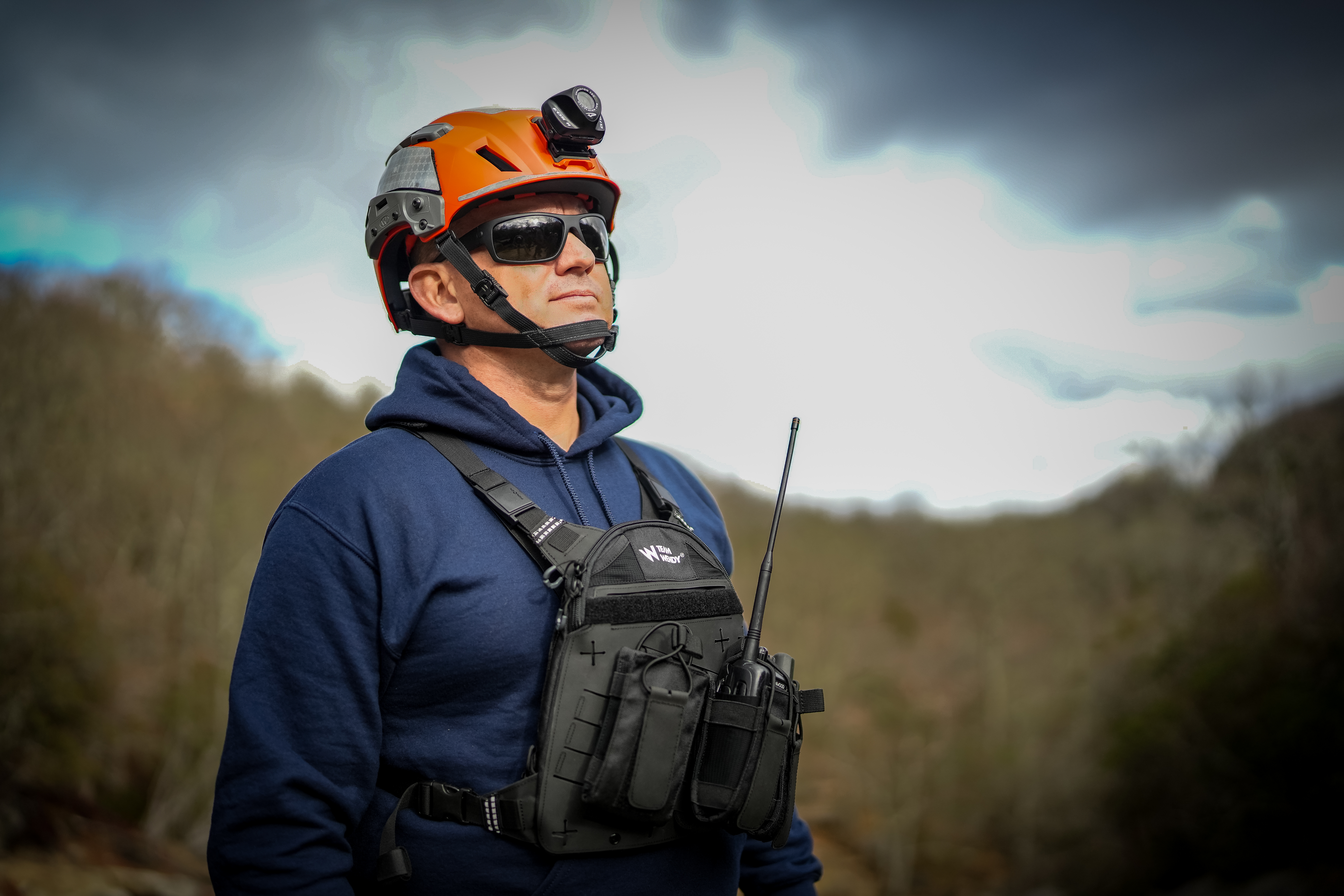 Man in helmet and radio rig