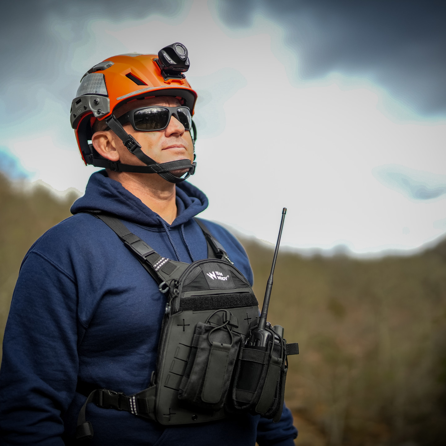 Man in helmet and radio rig