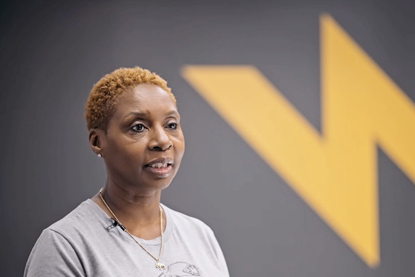 Image of a woman with Team wendy backdrop