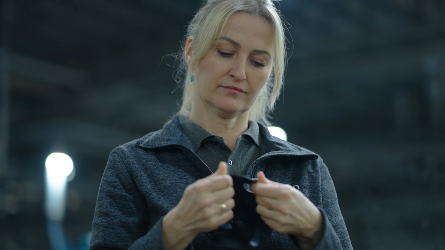 blonde woman looking at product