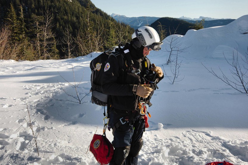 Man wearing harnesses and helmet in the snow