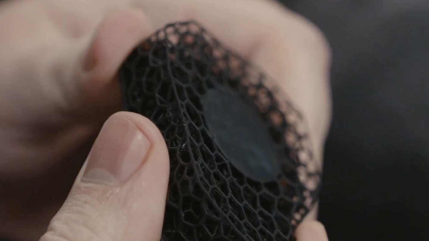 hands handling a net like material