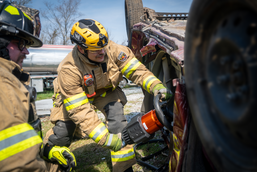 Firefighters wearing Team Wendy RECON Tactical helmets performing a vehicle extrication