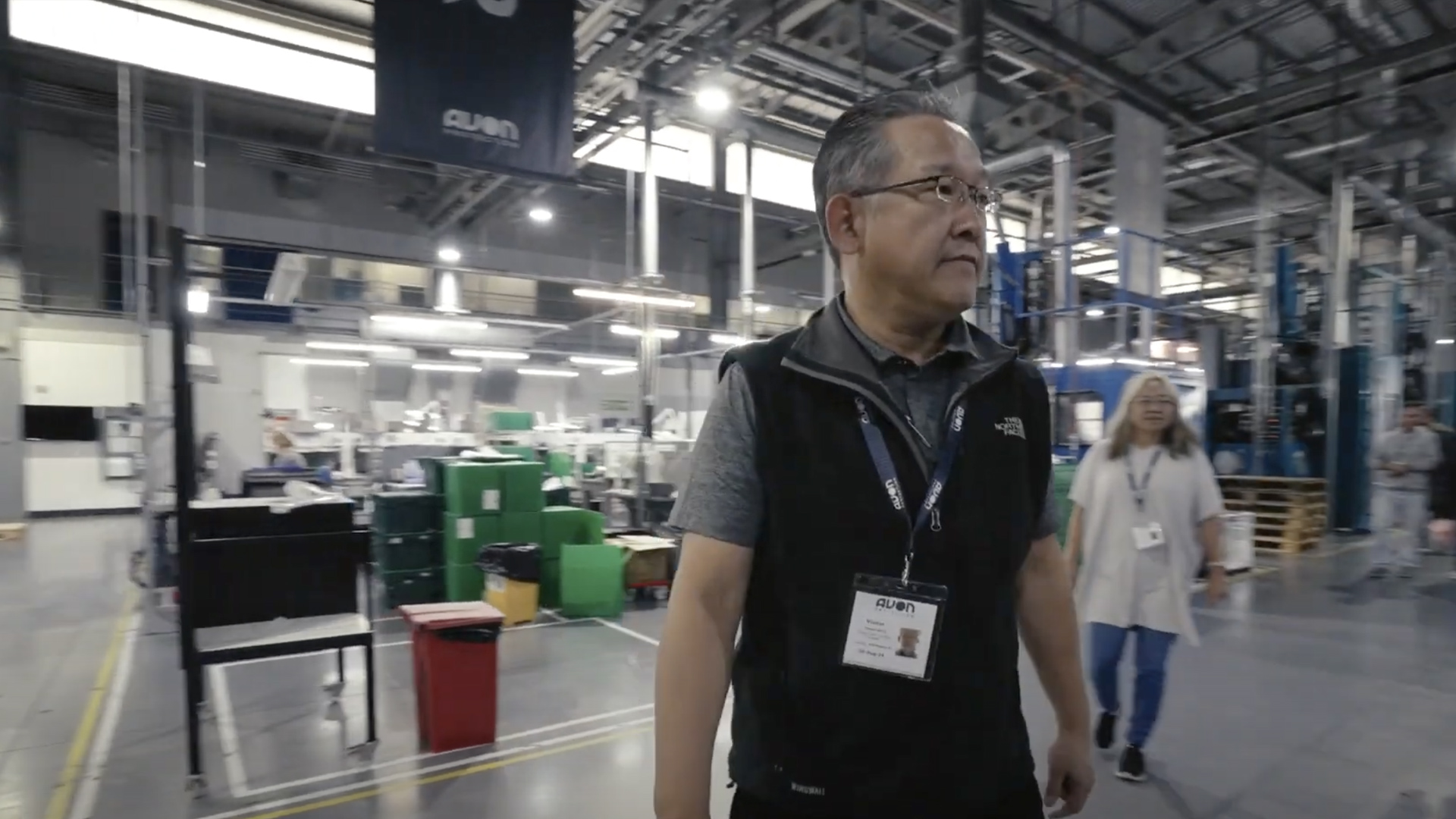 Man in glasses in a warehouse