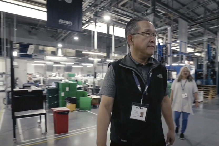 Man in glasses in a warehouse