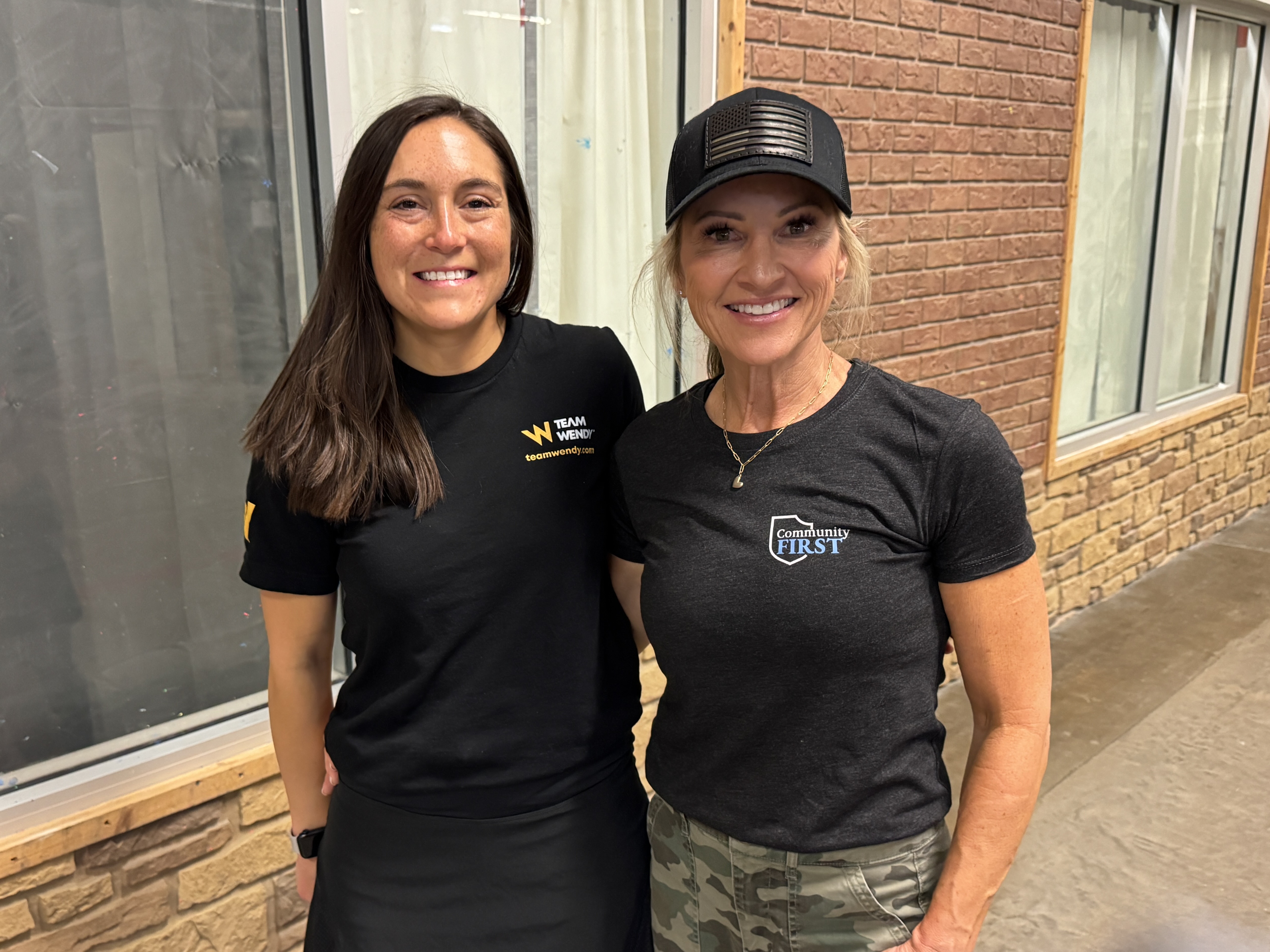 Team Wendy's Karlie Lipinsky standing with Kim Pastore of the Jorge Pastore Foundation