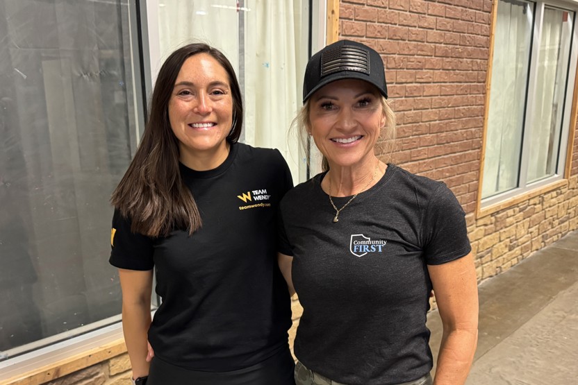 Team Wendy's Karlie Lipinsky standing with Kim Pastore of the Jorge Pastore Foundation