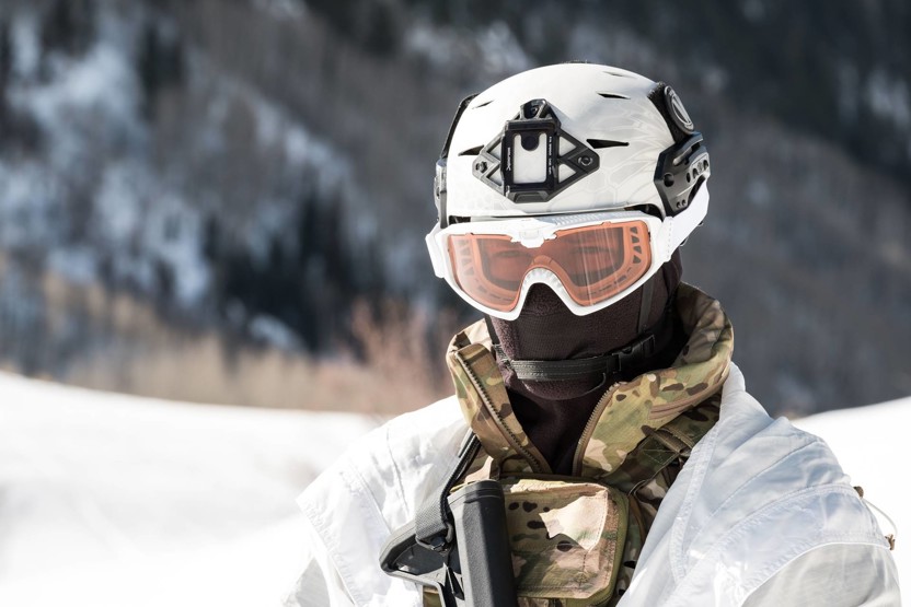 Man wearing ski goggles and a white helmet