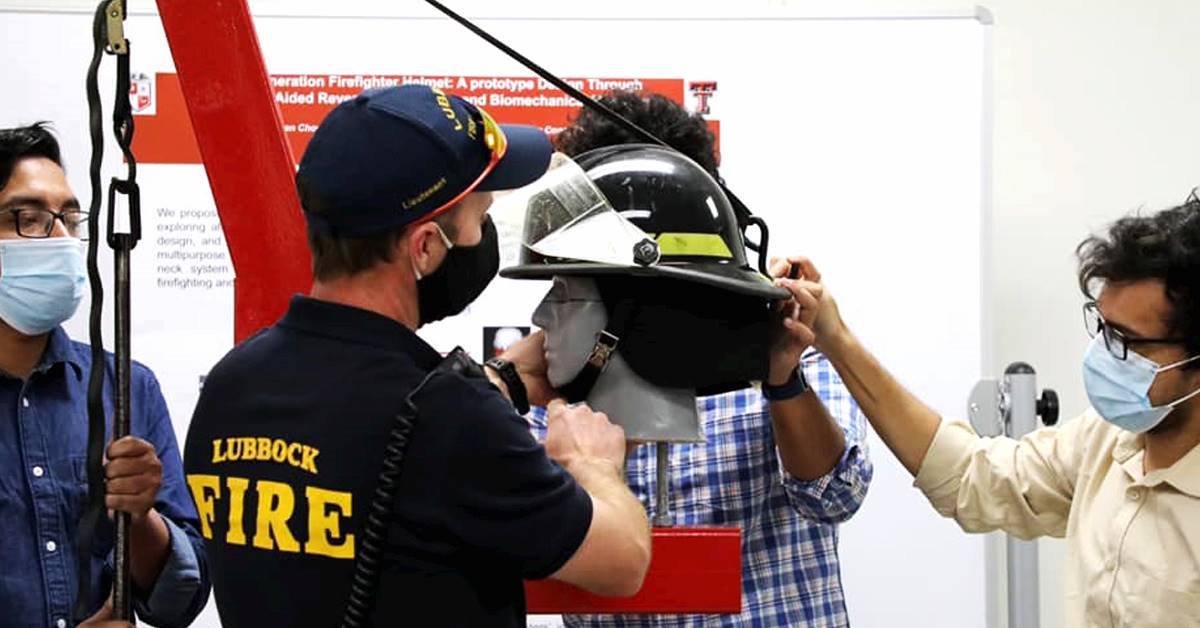 People wearing masks inspecting a helmet on a dummy head