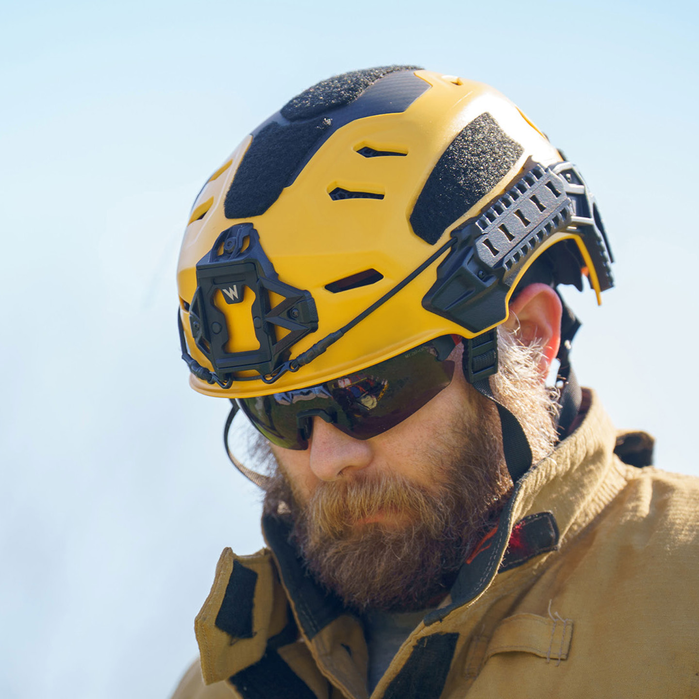 Firefighter wearing a yellow Team Wendy RECON Tactical helmet