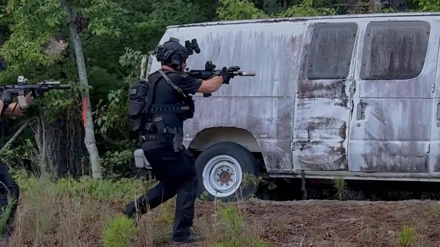 2 police officers wearing Team Wendy EXFIL Endurance helmets investigating a suspicious vehicle