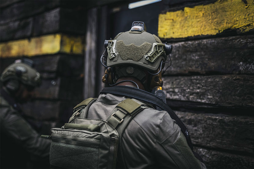 Image of soldier's back with helmet on