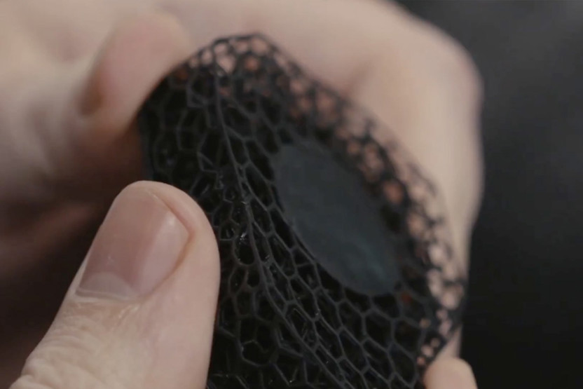 Hands holding a netted like material