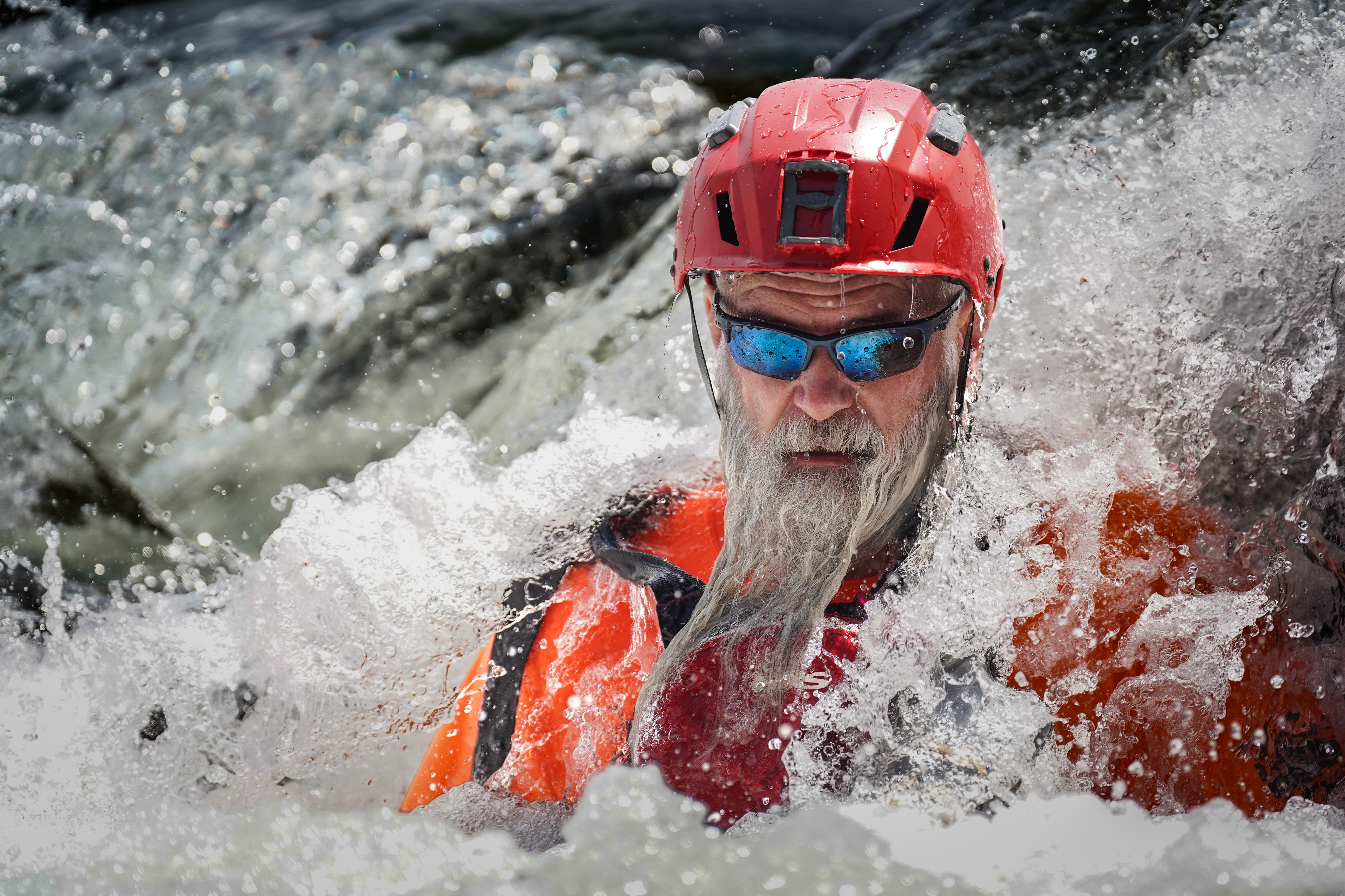 Search and Rescue professional wearing a Team Wendy SAR Tactical helmet in rapids