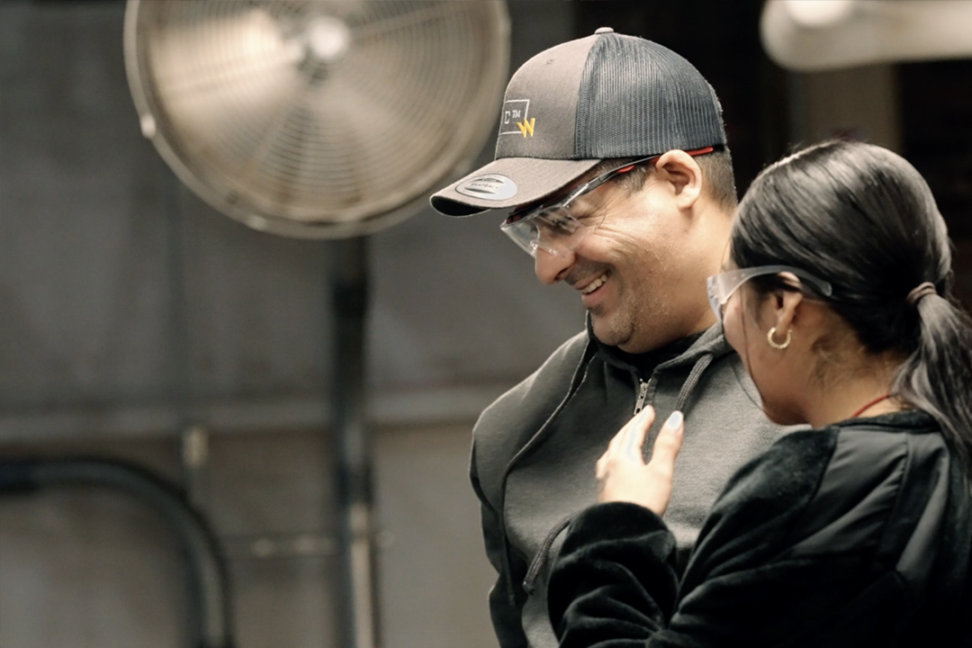 Woman and man talking and both wearing safety goggles