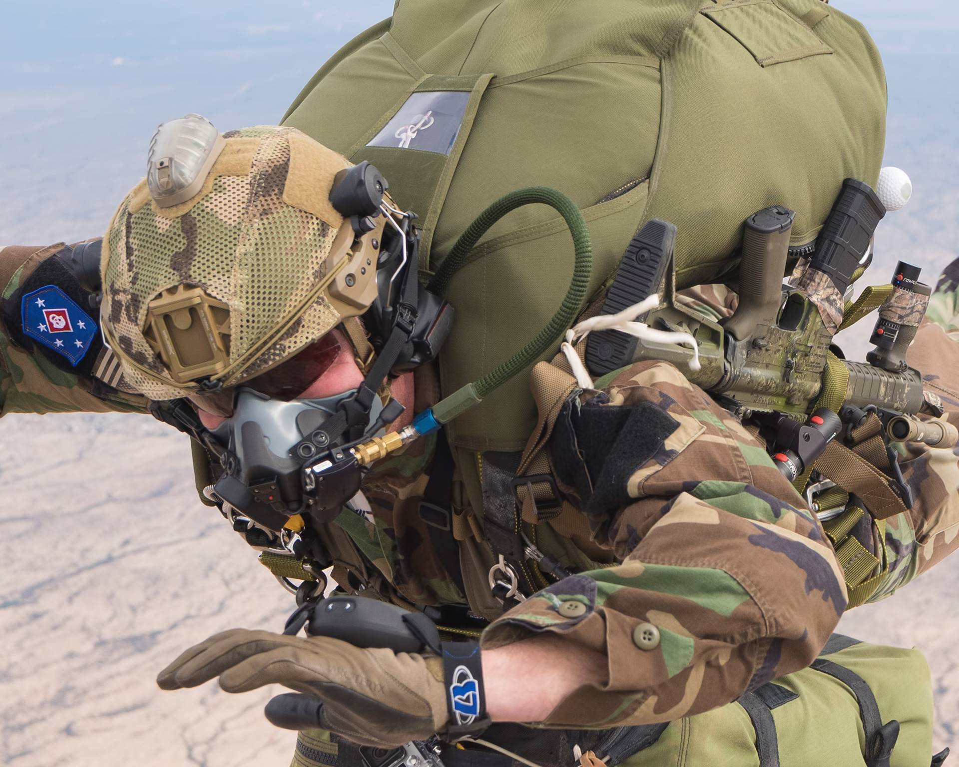 Man skydiving in camo