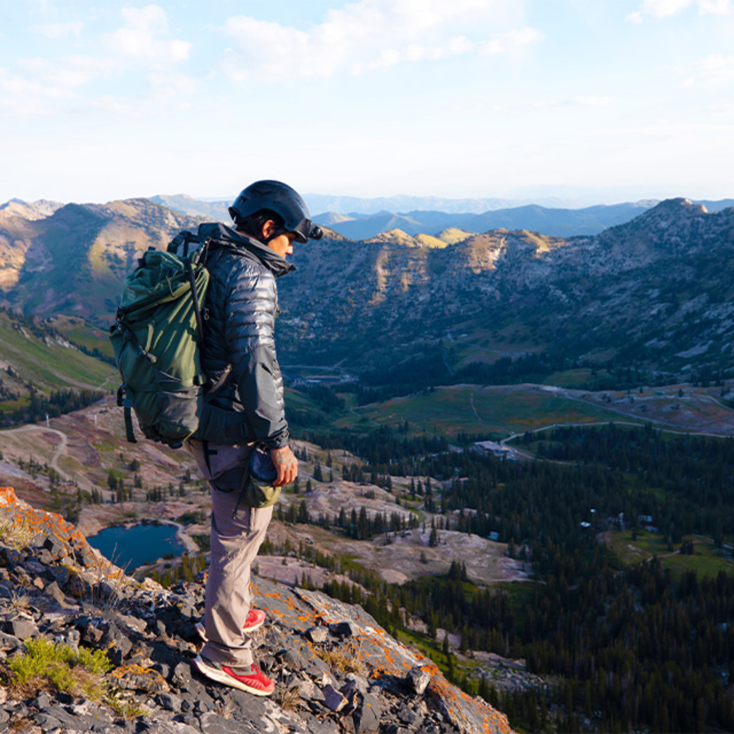 Man in helmet on top a mountain