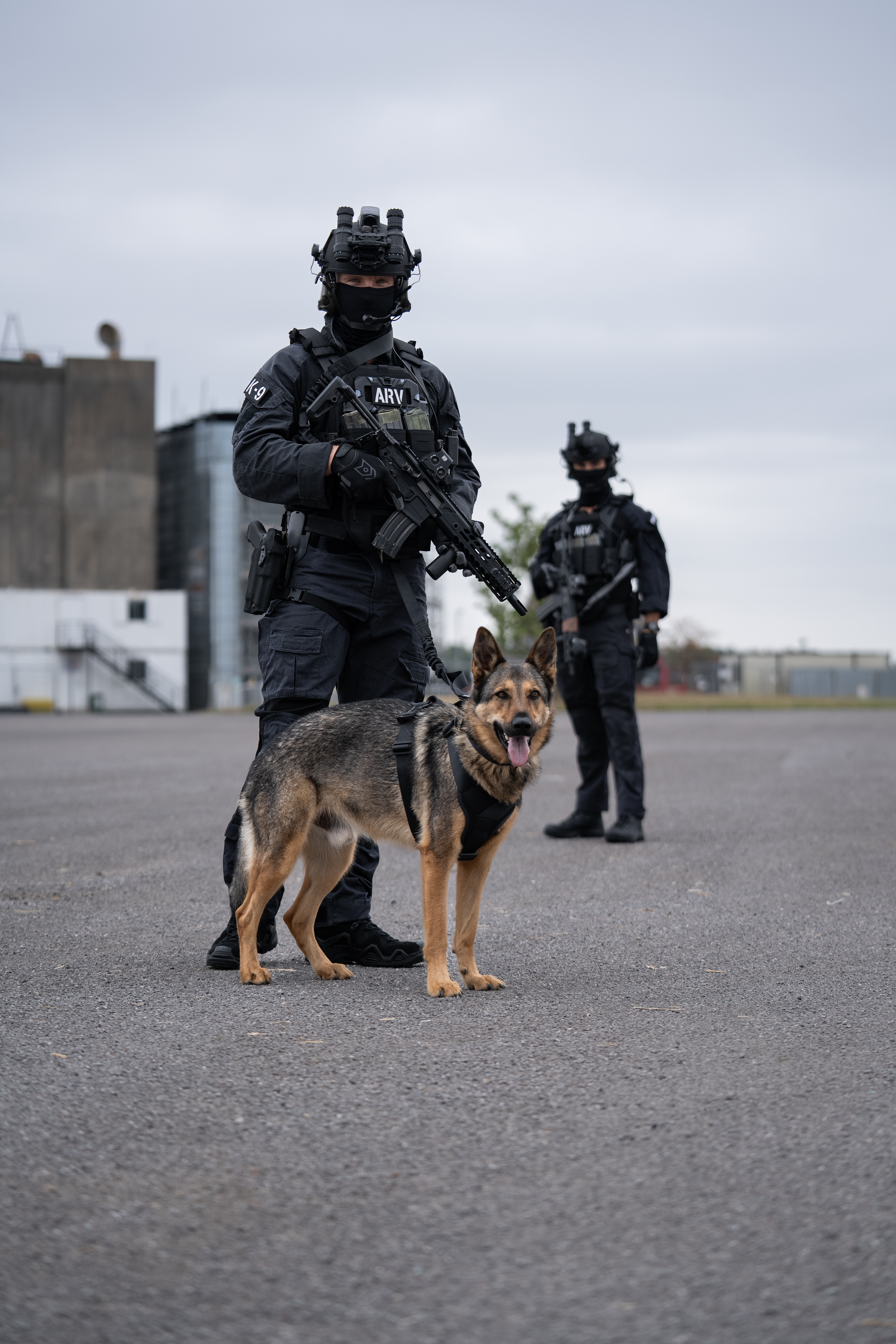2 soldiers in full combat gear including a Team Wendy ballistic helmet, and night vision goggles. 