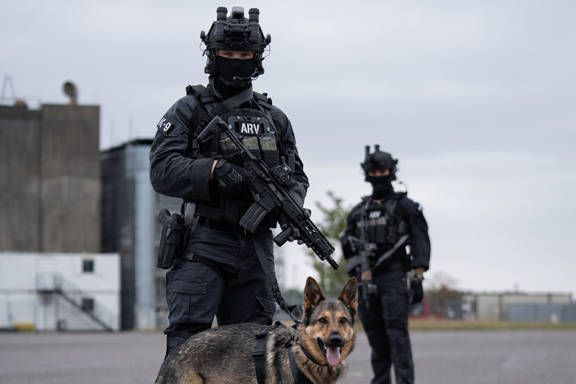 2 soldiers in full combat gear including a Team Wendy ballistic helmet, and night vision goggles.