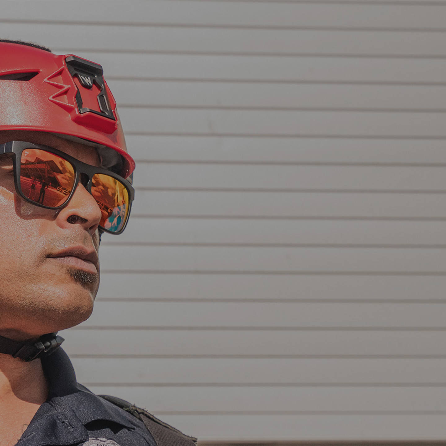 Firefighter wearing a red Team Wendy Rescuer helmet