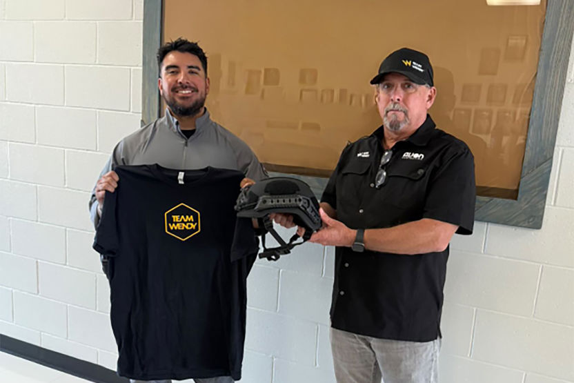Office saved by a Team Wendy EPIC ballistic helmet standing with Team Wendy Regional Sales Manager, Kyle Horne